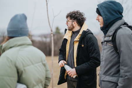 Young friends enjoying a quiet day outdoors in a natural park settingの写真素材