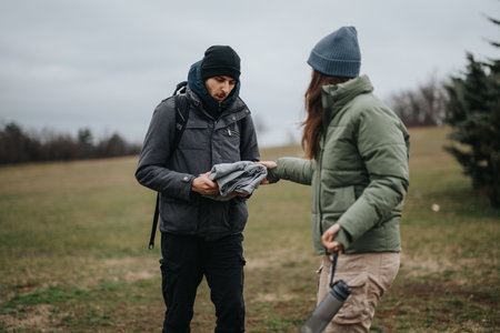 Two Friends Interacting Outdoors in a Natural Landscape