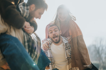 Group of friends enjoying a sunny autumn day together outdoors