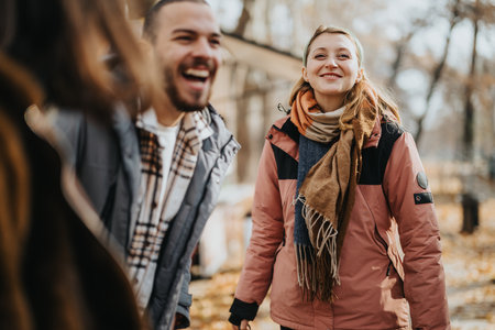Group of Happy Friends Smiling Outdoors During a Crisp Autumn Day