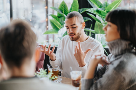Group of friends having a meaningful conversation in a cozy cafe setting