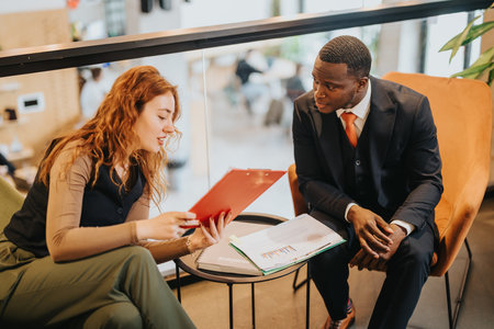 Business people discussing data charts and reports in a modern corporate office setting