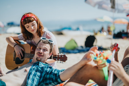 Group of friends enjoying a summer day at the sunny beachの写真素材