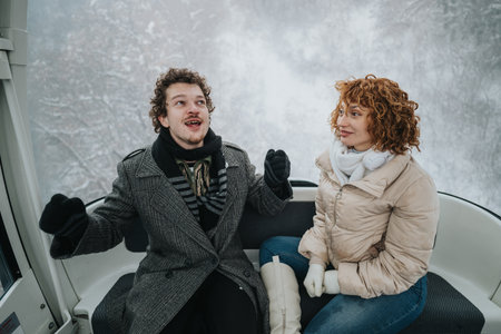 Friends enjoying a cable car ride during a snowy winter day