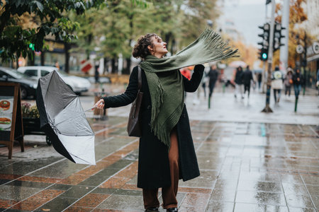 Woman outdoors holding an umbrella while enjoying a rainy day in the city