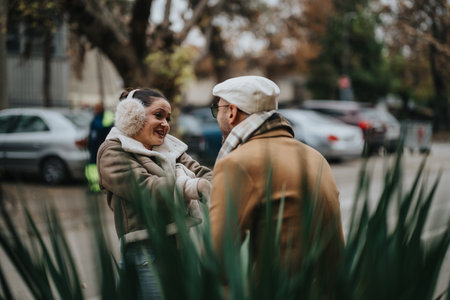 Smiling couple enjoying a joyful winter day outdoors in the city