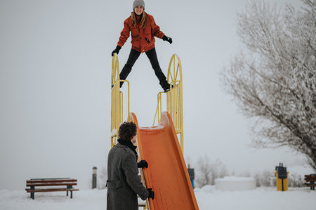 Playful Friends Enjoying a Winter Day on a Snow-Covered Playground