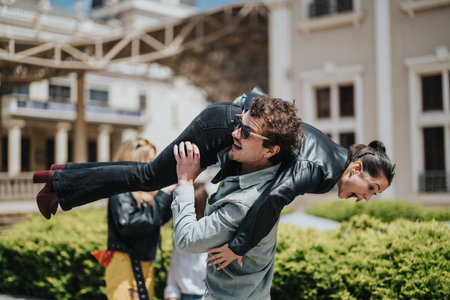 A playful moment shared between two cheerful friends outdoorsの写真素材