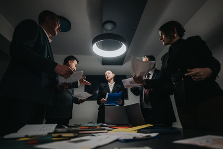 Professionals Collaborating on Project in a Modern Office Settingの写真素材