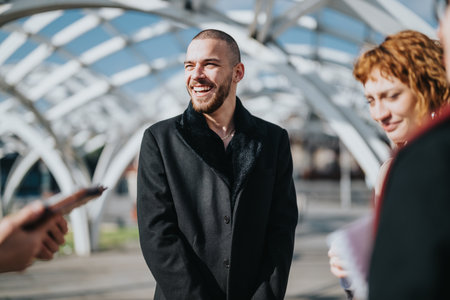 Business colleagues sharing a moment of laughter outdoors under a modern architectural structureの写真素材