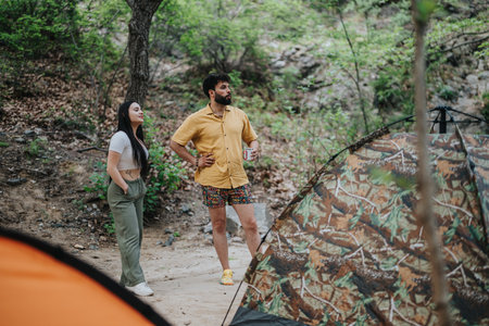 Young couple enjoying a camping trip in a scenic outdoor settingの写真素材