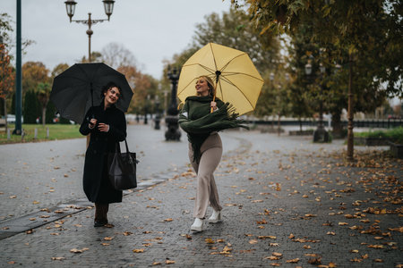 Two women enjoying a rainy stroll with umbrellas on a fall day