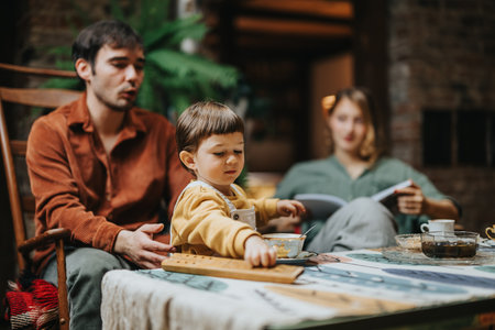 Family Enjoying Leisure Time with a Child Playing at a Table