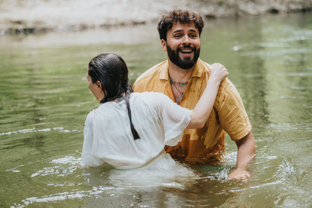 Two happy individuals enjoying a fun moment in a serene river setting