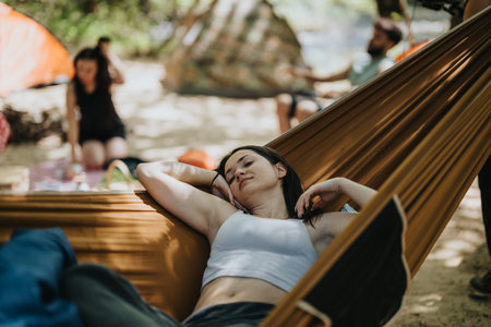 Relaxing Outdoors in a Hammock on a Sunny Summer Dayの写真素材