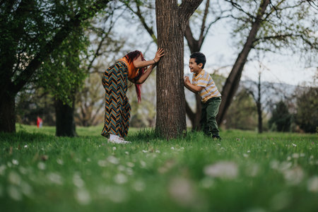 Filipino mother and child playing in park to bond and create memoriesの写真素材