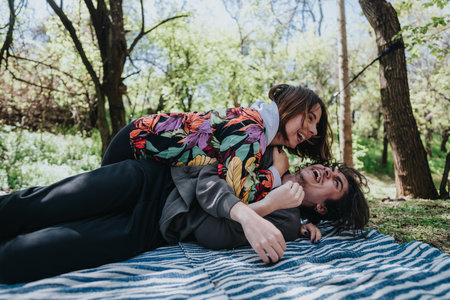 Young couple laughing and enjoying their playful moment together outdoors