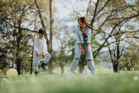 Mother and son enjoying outdoor activities and bonding in a sunny parkの写真素材