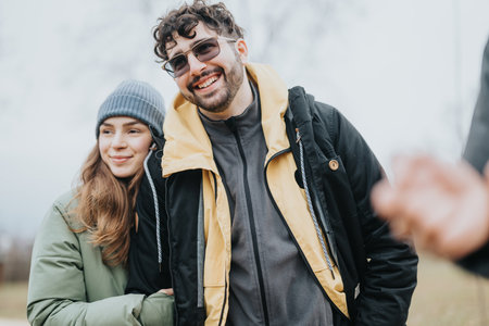 Happy young friends enjoying time outdoors in the fresh winter air