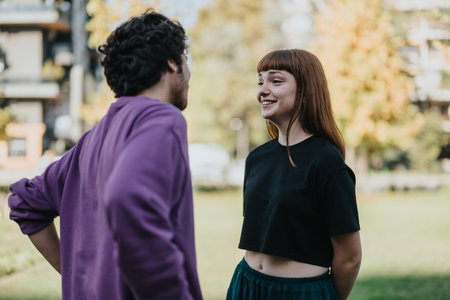 Happy young couple enjoying time together outdoors in a park
