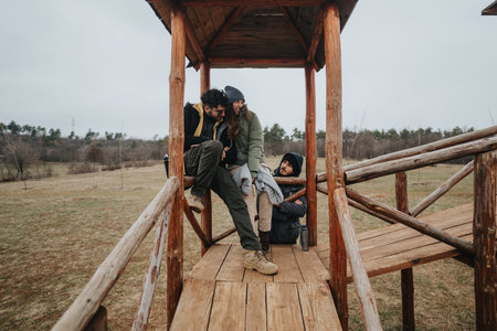 Happy friends enjoying outdoor time on a wooden observation deck