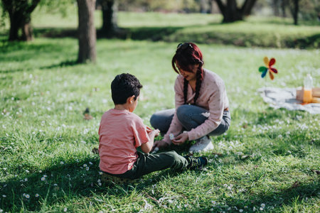 Mother and child bonding in a peaceful green park on a sunny day.