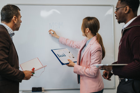 Group of professionals discussing business strategies and presenting ideas during a collaborative meeting.の写真素材