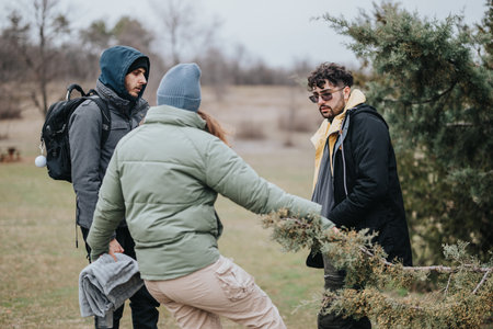 Group of friends exploring a natural setting on a chilly day
