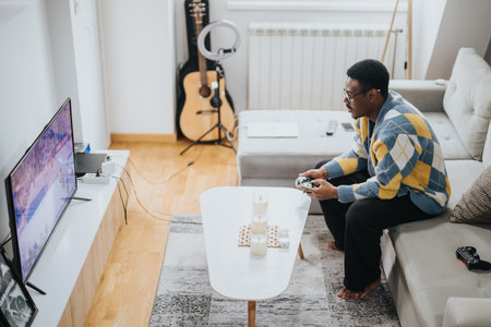 Man focused on playing video games in a cozy and relaxing living room