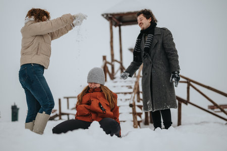 Group of friends enjoying a snowy winter day with fun and playful activities