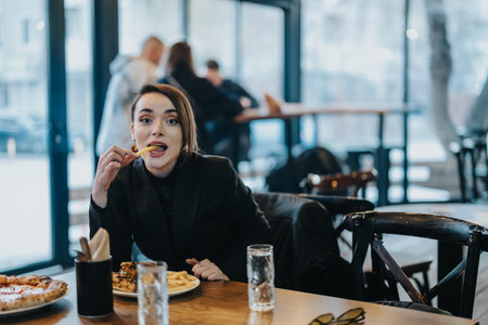 Young woman eating in a modern restaurant enjoying her meal