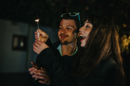 Friends enjoying a during a nighttime birthday celebration outdoors
