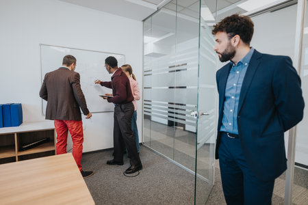 Group of business professionals collaborating during a meeting in a modern office