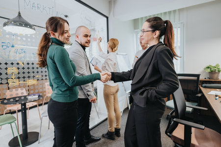Colleagues collaborating in a modern office space during a professional meeting