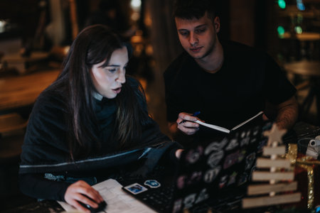 Two individuals collaborating at a cozy cafe workspace for brainstorming ideas