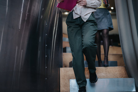 Dynamic perspective of professionals walking down modern stairs