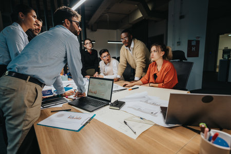 Group of business professionals working together in a modern office setting