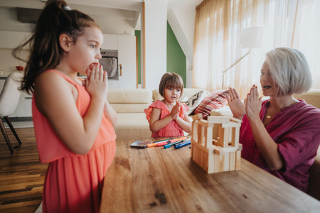 Mother and daughters playing with wooden blocks in living room