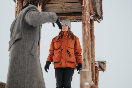 Young Friends Enjoying a Scenic Winter Adventure Together Outdoors
