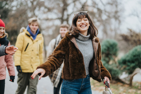Group of friends enjoying an outdoor walk in winter clothingの写真素材