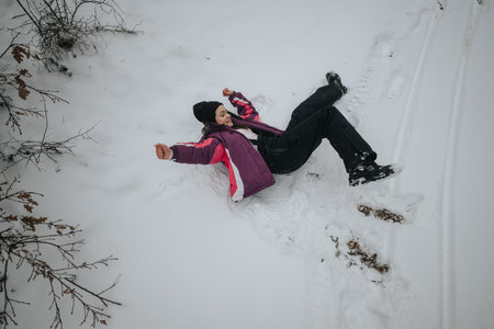 Woman Enjoying a Winter Outdoor Moment in Snowy Nature