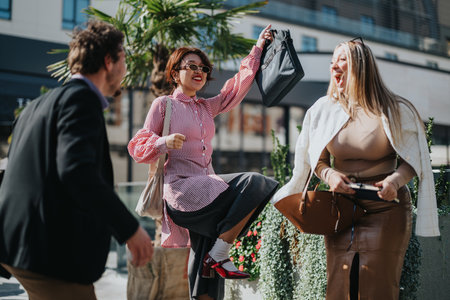 Excited business colleagues celebrating success in urban setting