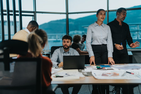 Multiracial business team brainstorming in modern office settingの写真素材