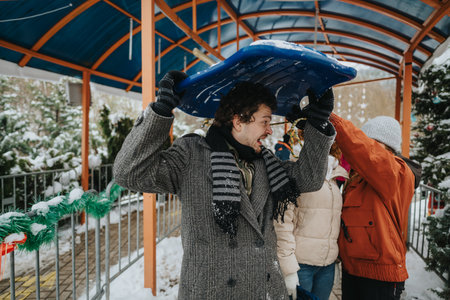 Friends playing outdoors while enjoying a snowy winter day