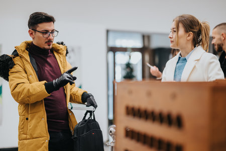 Young professionals discussing ideas in a collaborative work setting.の写真素材