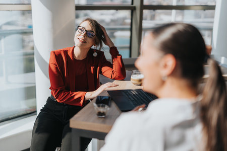 Business employees enjoying a break in the office kitchenの写真素材