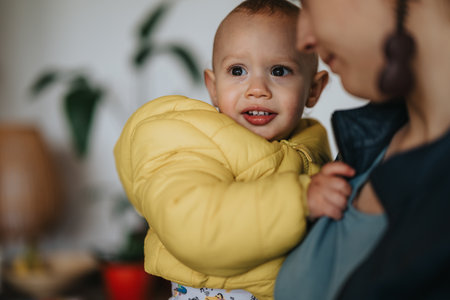 Mother holding her young child close in a loving and warm embrace