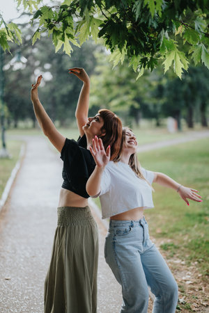 Two friends enjoying their time under green trees in a park outdoors