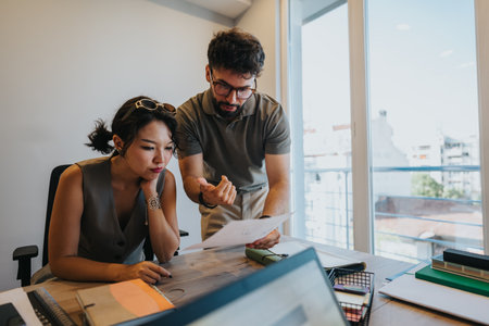 Young couple consulting with bank adviser for financial and loan-related guidance.