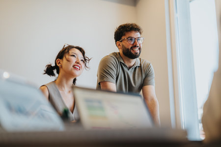 Young couple seeking financial advice from an advisor in an office settingの写真素材